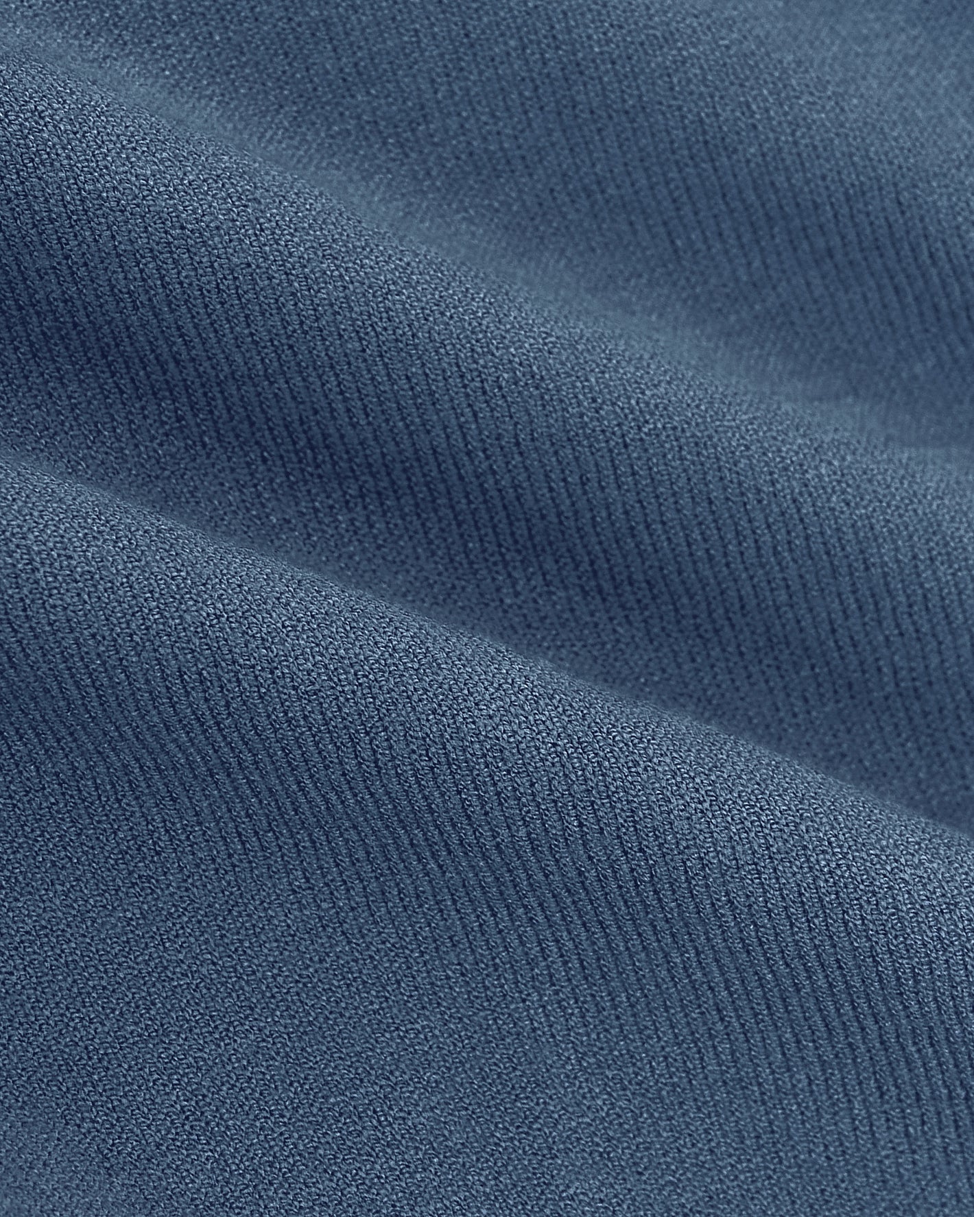 Fiord Dressy Polo's blue knit close-up, showcasing soft, detailed texture.