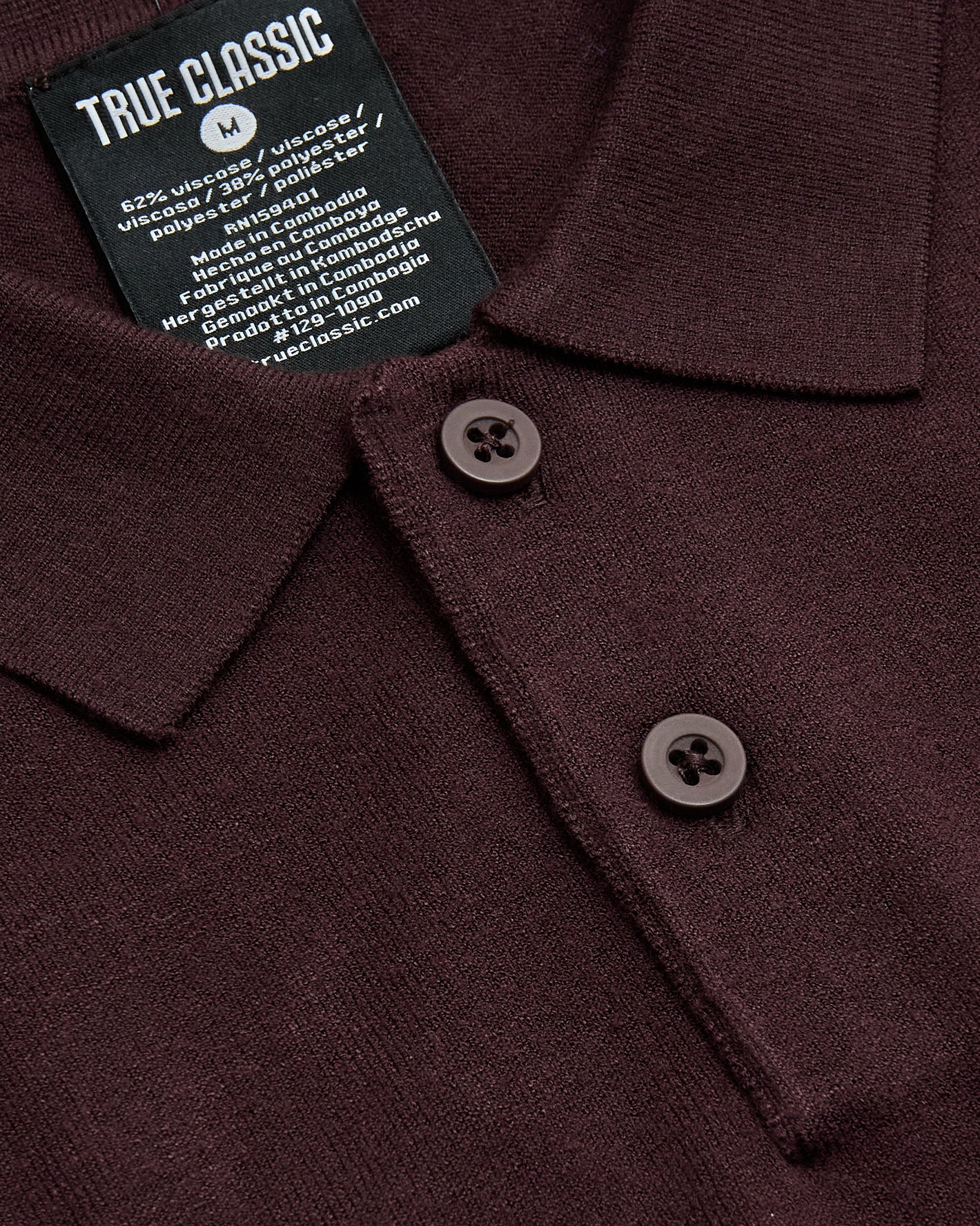 Java Dressy Polo with knitted collar, two-button placket, and “TRUE CLASSIC” label.