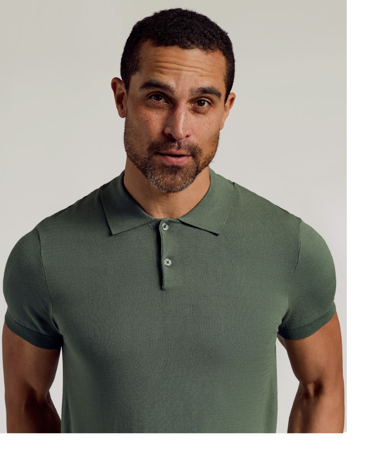 Man wearing Moss Dressy Polo, fitted, short-sleeve, olive-green, direct gaze.
