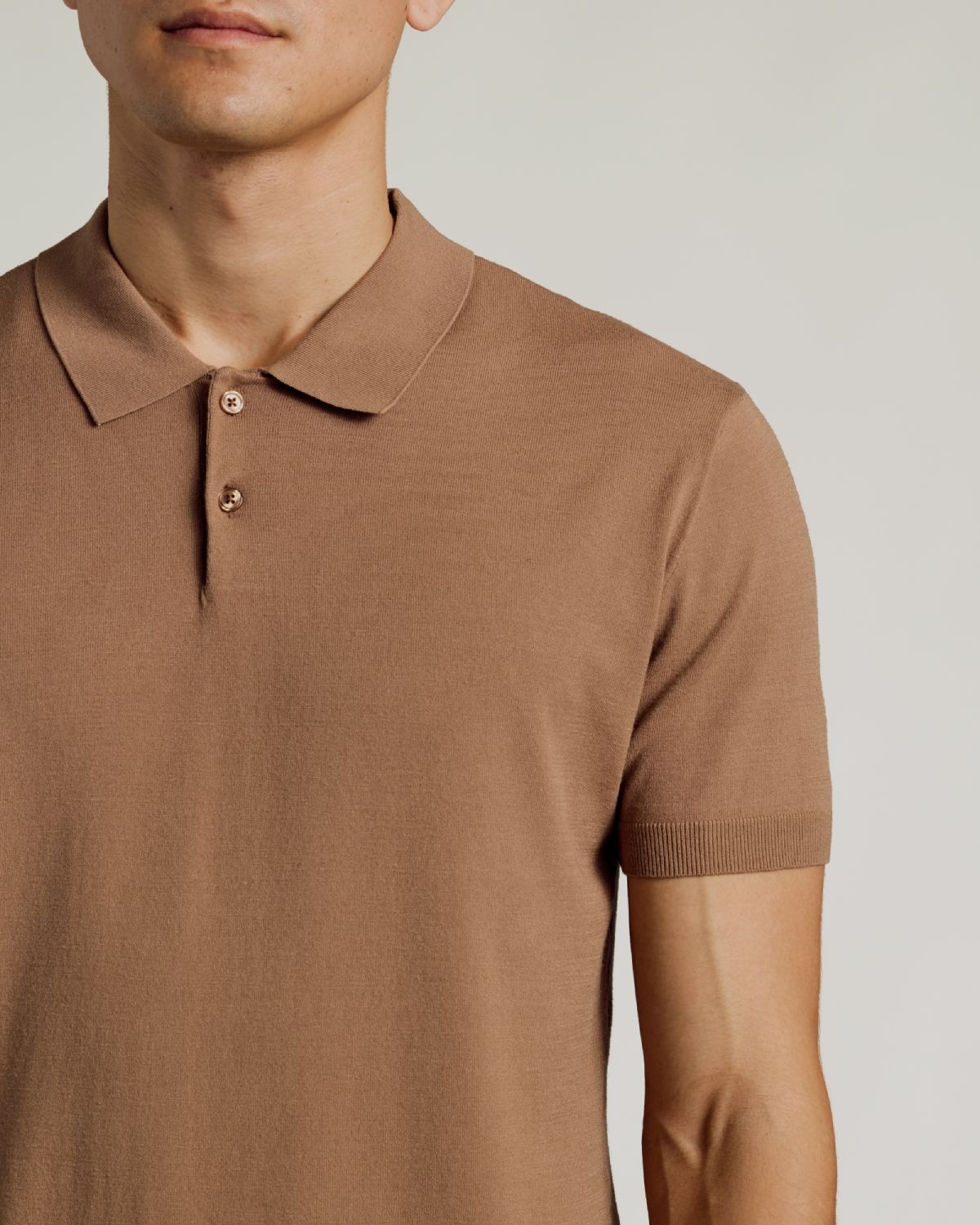 Truffle Dressy Polo on man, showcasing fit and classic collar.