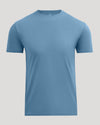A plain short-sleeve crewneck t-shirt in a muted slate blue color, displayed on a neutral light gray background.