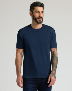 True ClassicMan in Core Premium Pima Crew Neck T-shirt, tattoos visible.