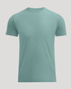 A short-sleeve crewneck t-shirt in a muted sage green color, displayed on a solid light gray background.