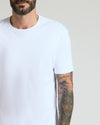 Pima Cotton Blend Crew 4-Pack on tattooed man's upper body.