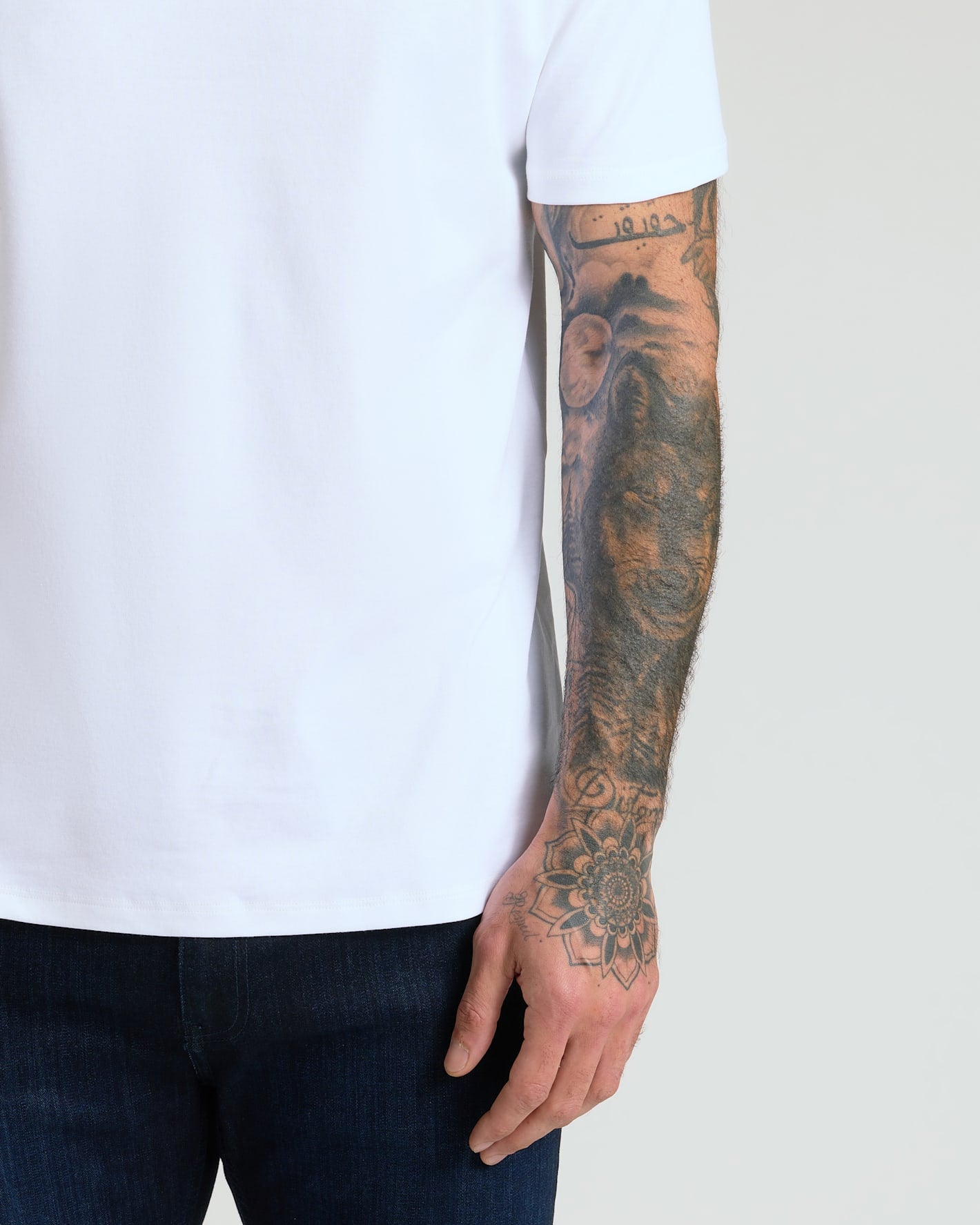 Pima Cotton Blend Crew 4-Pack on person with tattooed arm.