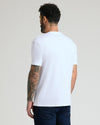Man wearing Pima Cotton Blend Crew 4-Pack T-shirt and jeans.