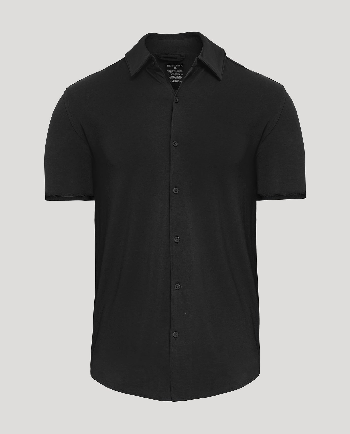 Black Short Sleeve Comfort Knit Shirt with button-up design and spread collar.