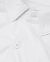 White Short Sleeve Comfort Knit Shirt close-up of collar and button.
