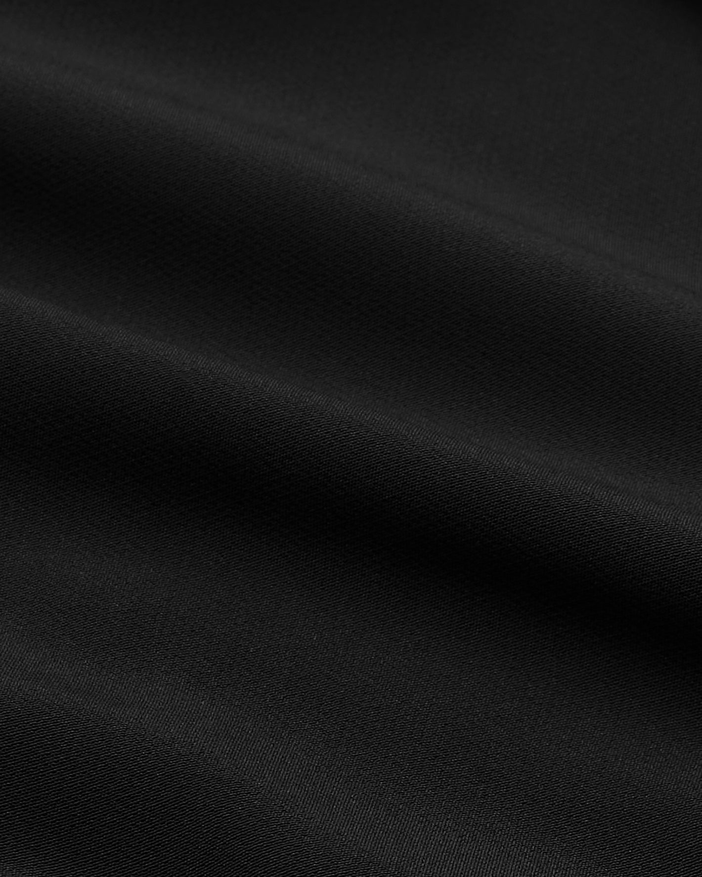 Black Performance Dress Shirt with fine weave, ultra-soft, wrinkle-resistant fabric.