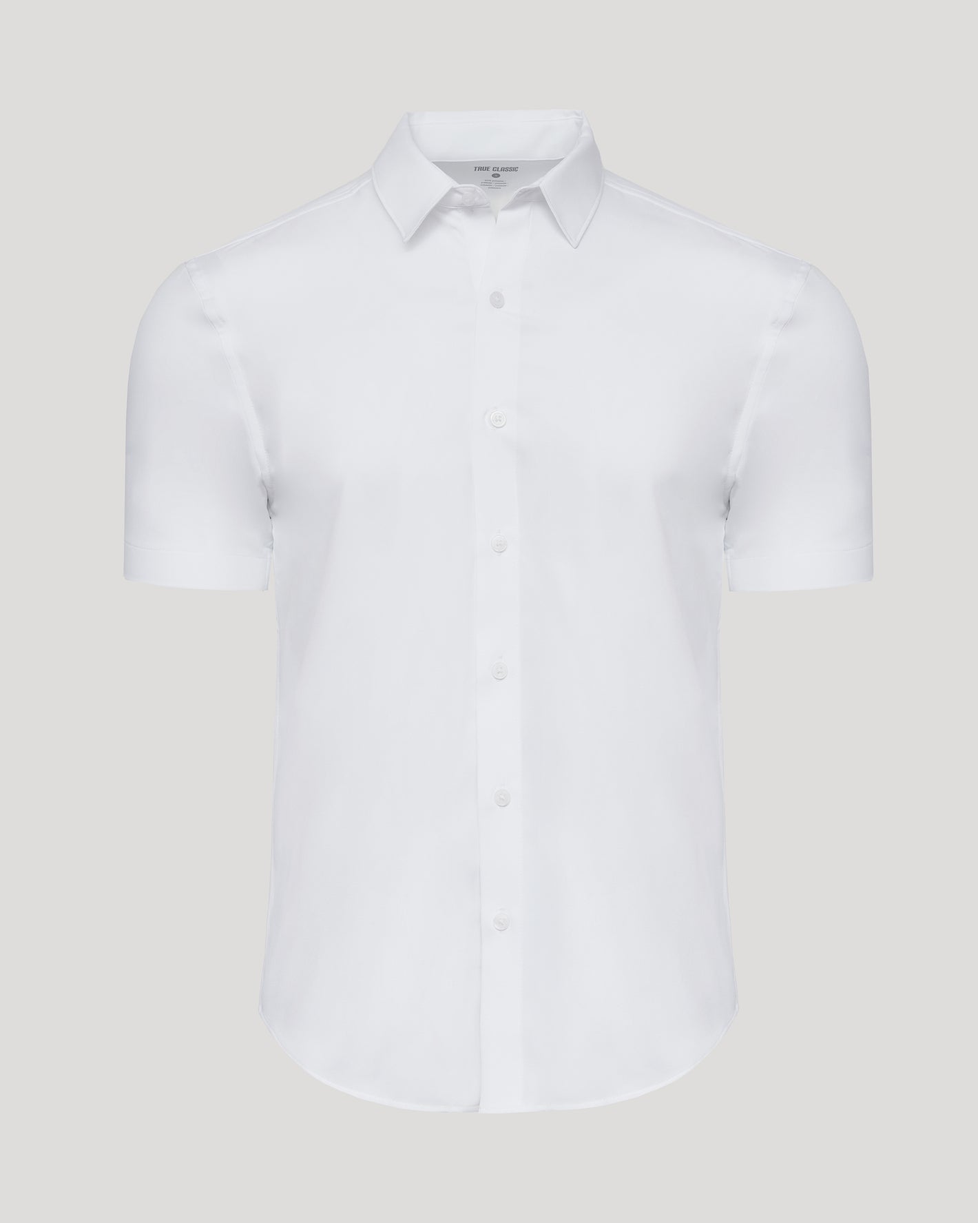 White Performance Dress Shirt, short-sleeved, button-front, on gray background.