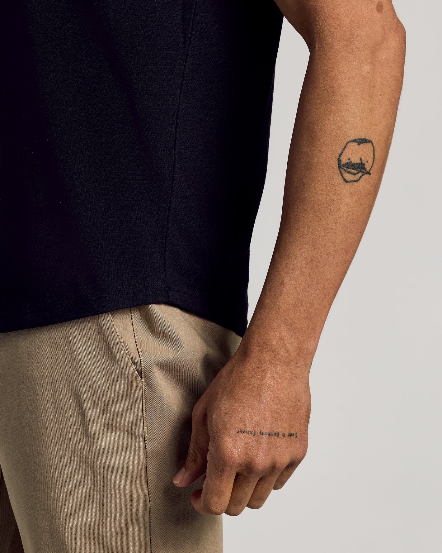 Black Curved Hem Classic Crew Neck with bicep-hugging fit.