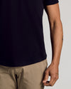 Black Curved Hem Classic Crew Neck 6-Pack worn with light khaki pants.