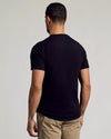 Black Curved Hem Classic Crew Neck, back view, with tattoos visible.