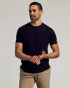 Man wearing Wardrobe Curved Hem Classic Crew Neck T-shirt and tan chinos.