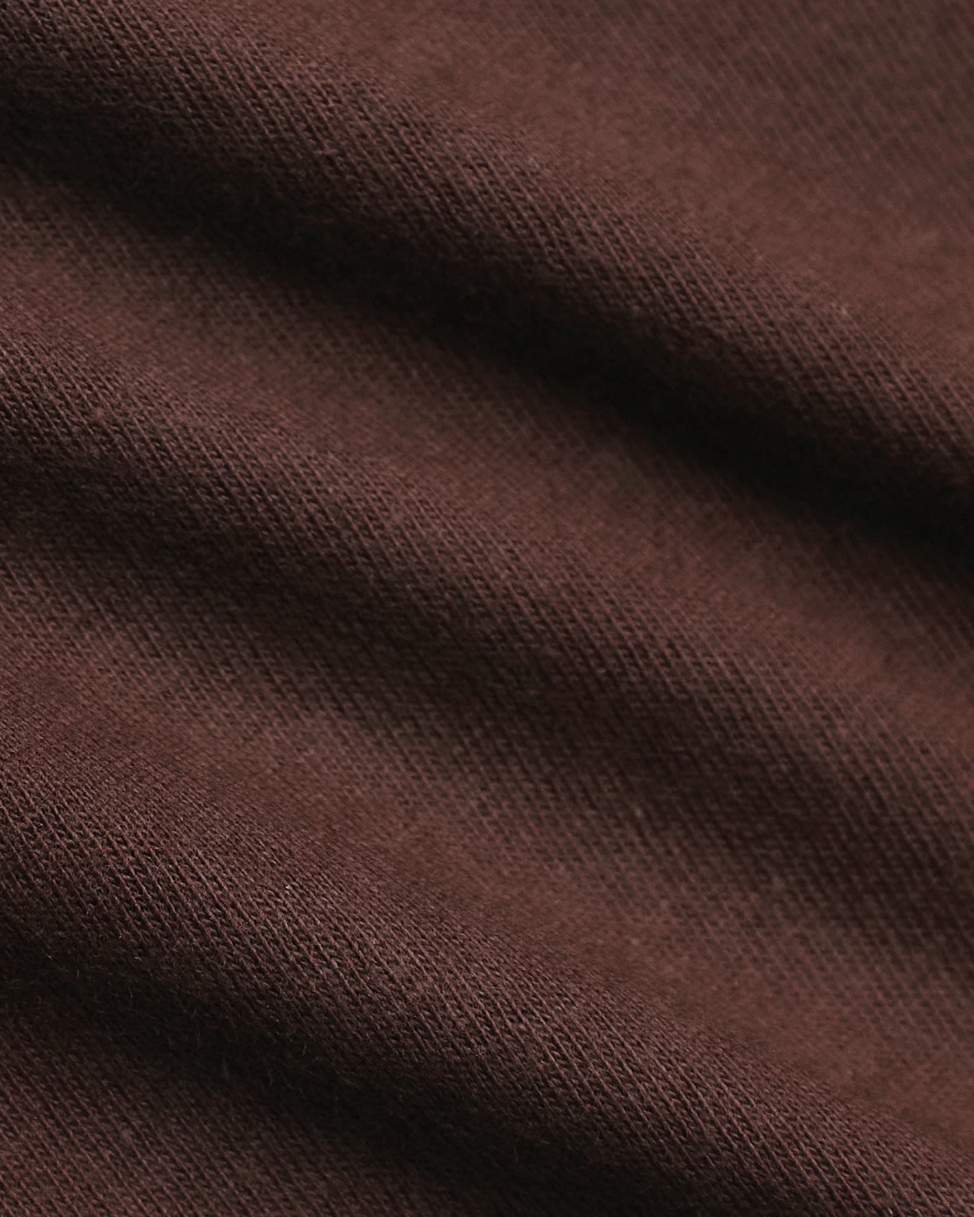Close-up of Seasonal Classic Curved Hem Crew Neck's textured knit fabric.