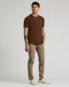 Carob Curved Hem Classic Crew Neck on young man, casual pose.