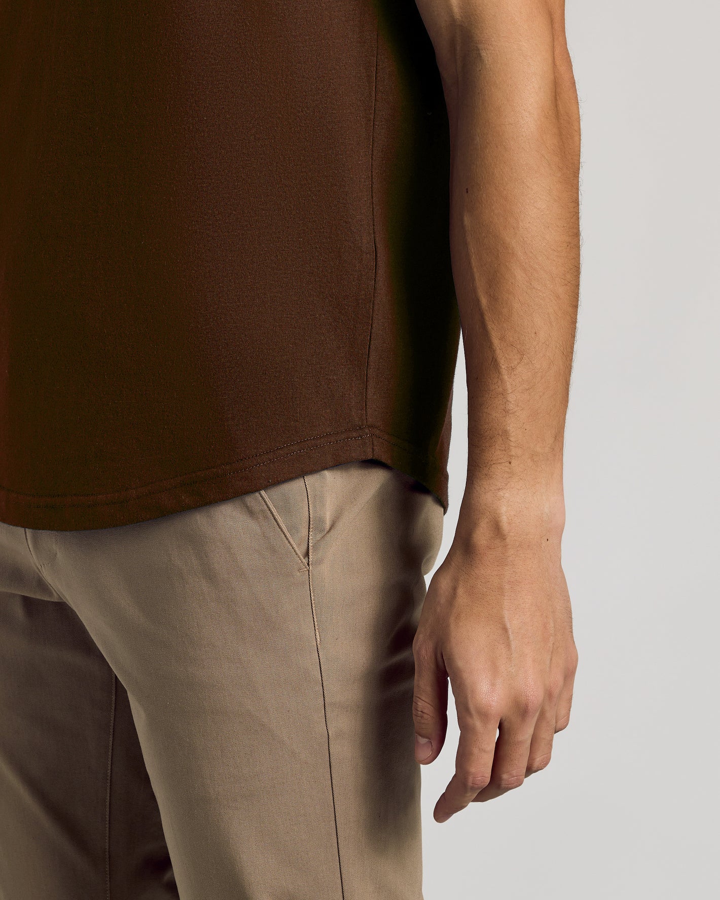 Seasonal Classic Curved Hem Crew Neck tee on model with khaki trousers.