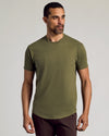 Man wearing The Staple Curved Hem Classic Crew Neck in olive.