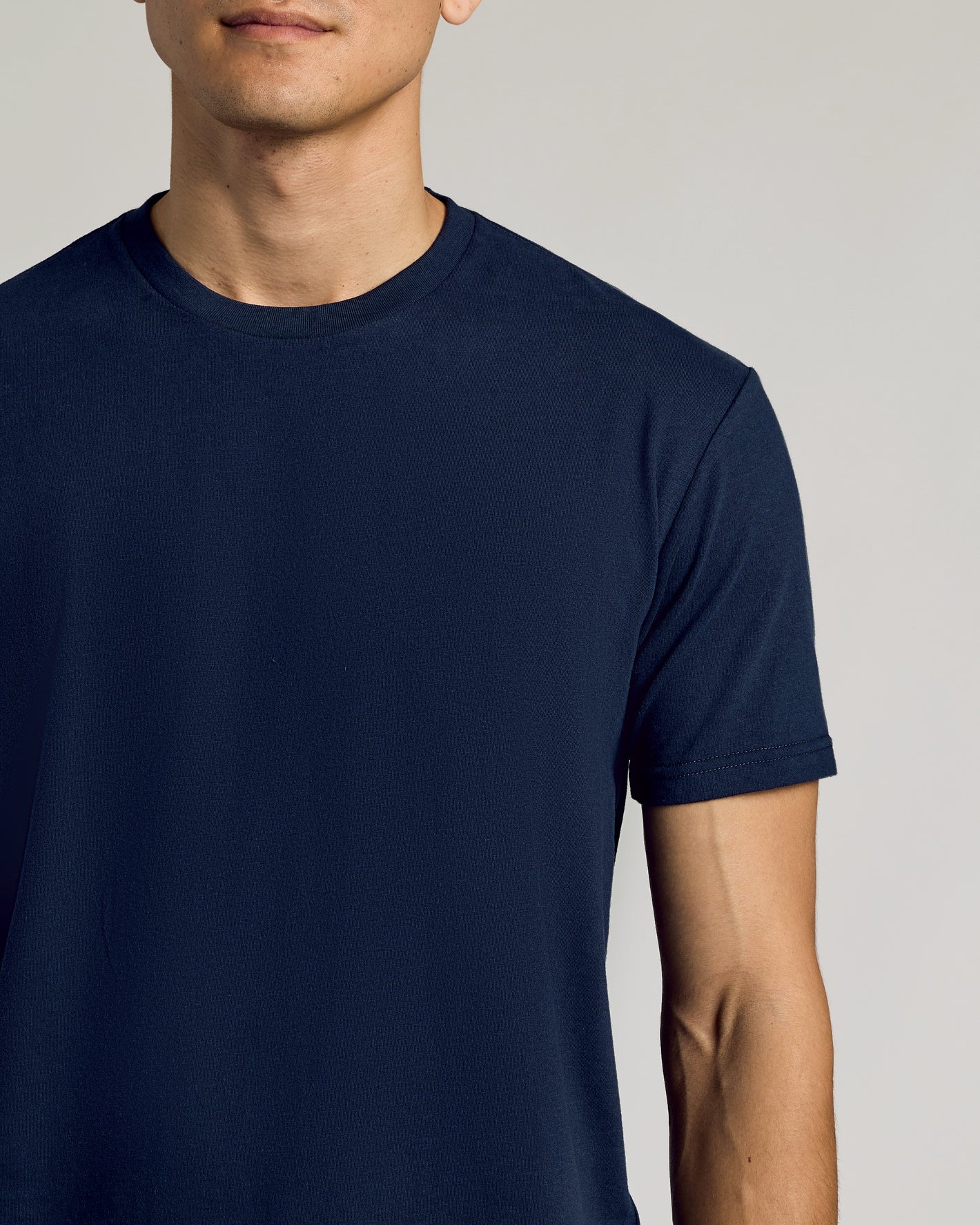 Navy Curved Hem Classic Crew Neck on model, snug fit, curved hem.