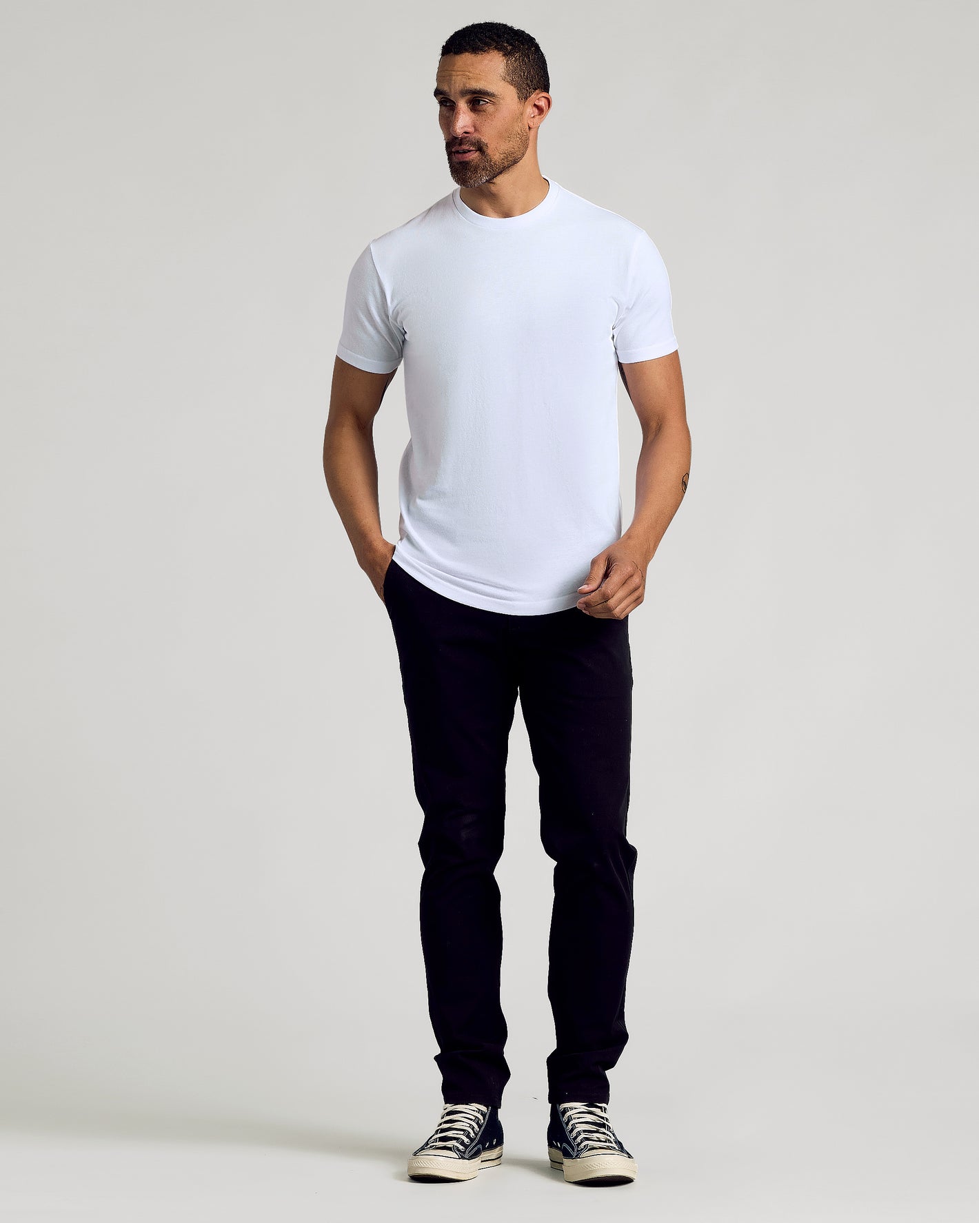 Man in All White Curved Hem Classic Crew Neck T-shirt.