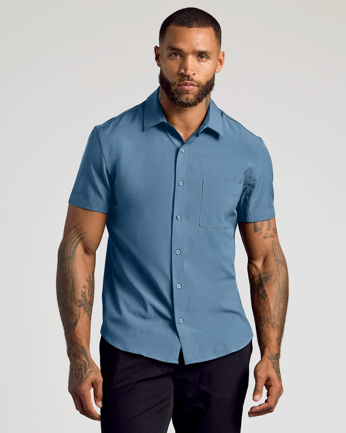 Model in Gray Fiord Short Sleeve Ripstop Commuter Shirt.