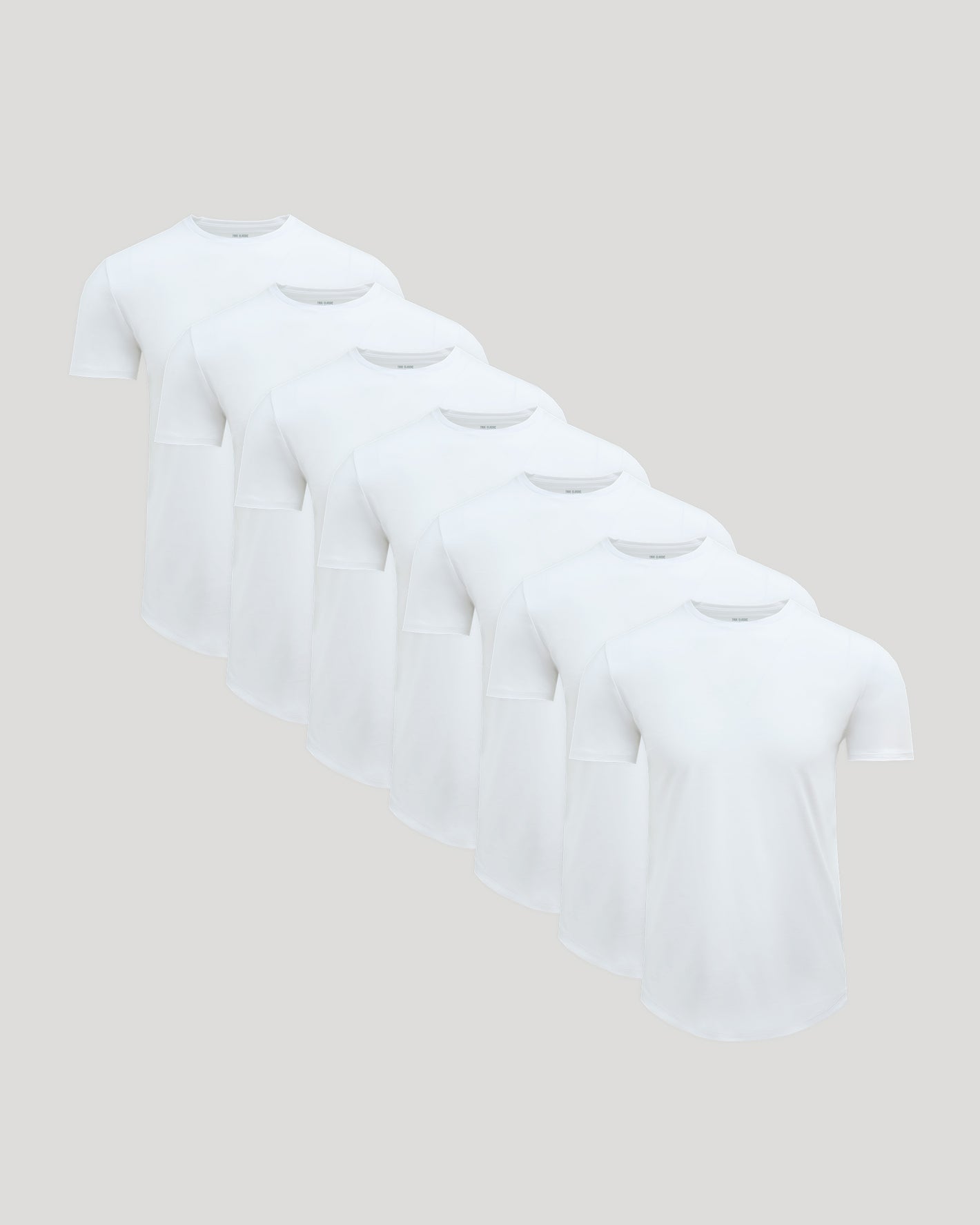 All White Pima Cotton Blend Curved Hem Crew 7-Pack cascading display.