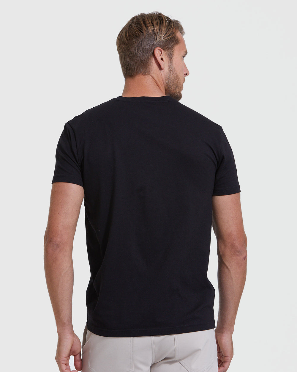 Man wearing Standard 3-Pack black v-neck T-shirt, back view.