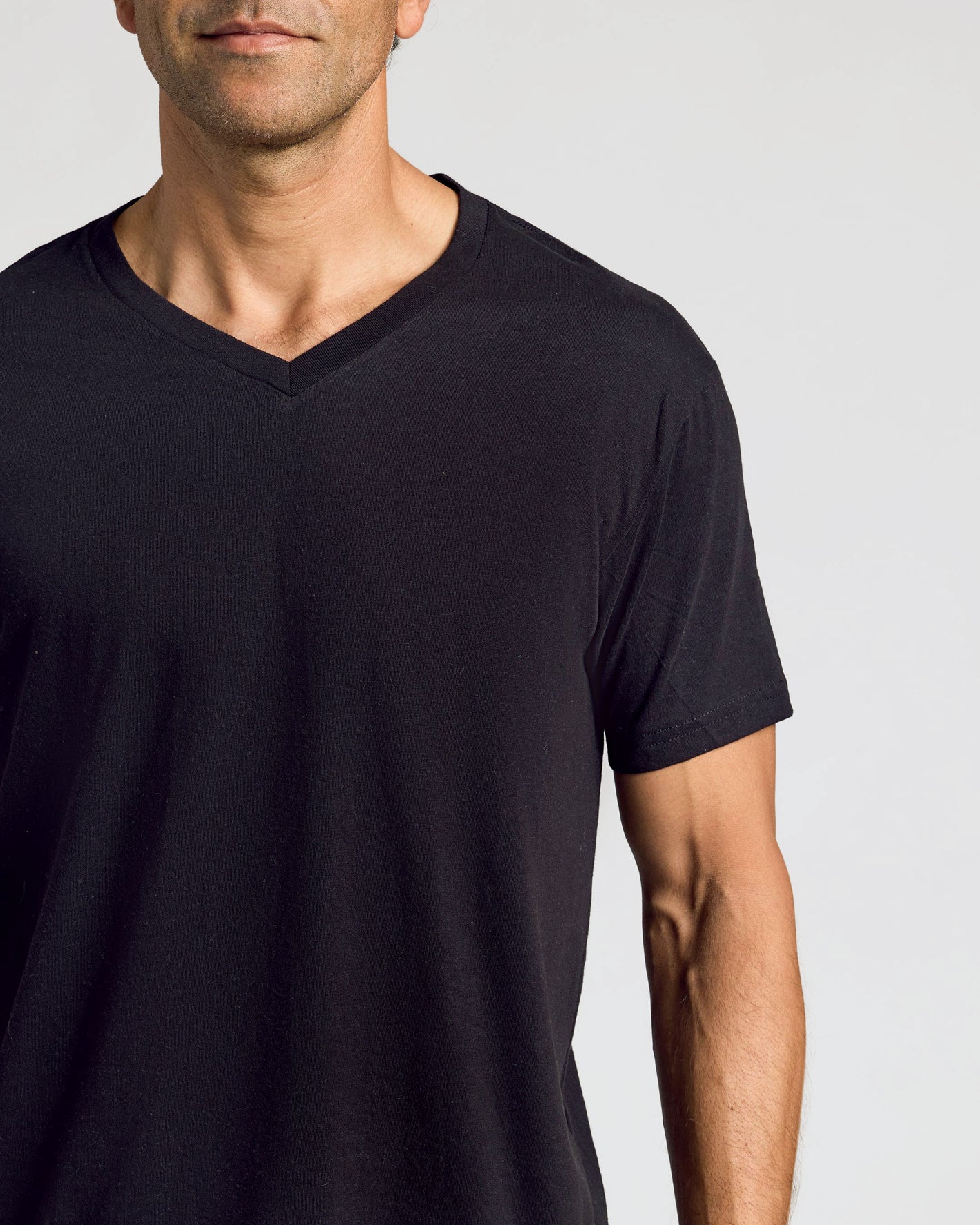 Black & White V-Neck 10-Pack: man in black V-neck T-shirt.