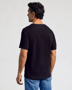 True ClassicAll Black Classic V-Neck 10-Pack on man, back view.