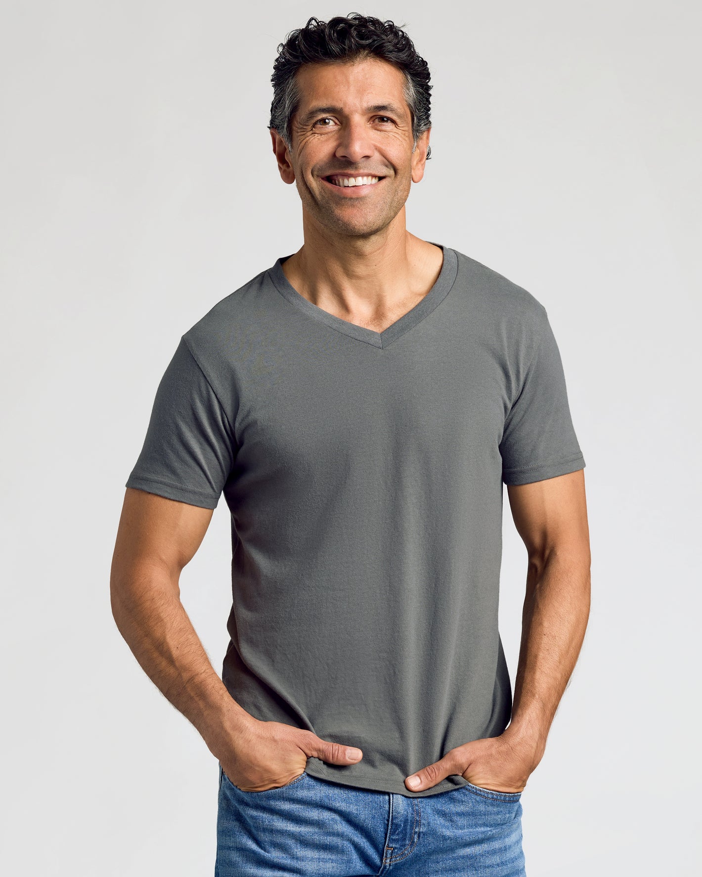 Man wearing Essential V-Neck Tee, showcasing dark-gray, fitted style.