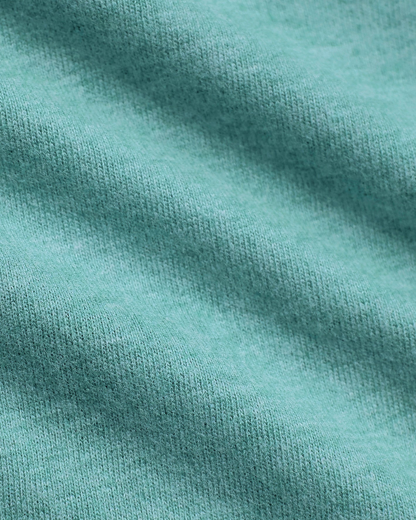 Dark Heather Oceanic Classic V-Neck close-up of teal knitted fabric texture.