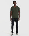 Model wearing Dark Olive V Neck T Shirt and indigo jeans.