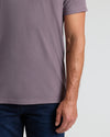 Dark Heather Amethyst Classic V-Neck tee on model with jeans, tattoo visible.