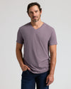 Man wearing Dark Heather Amethyst Classic V-Neck T-shirt with jeans.