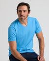 Man wearing Dark Heather Bahama Blue Classic V-Neck, relaxed posture.