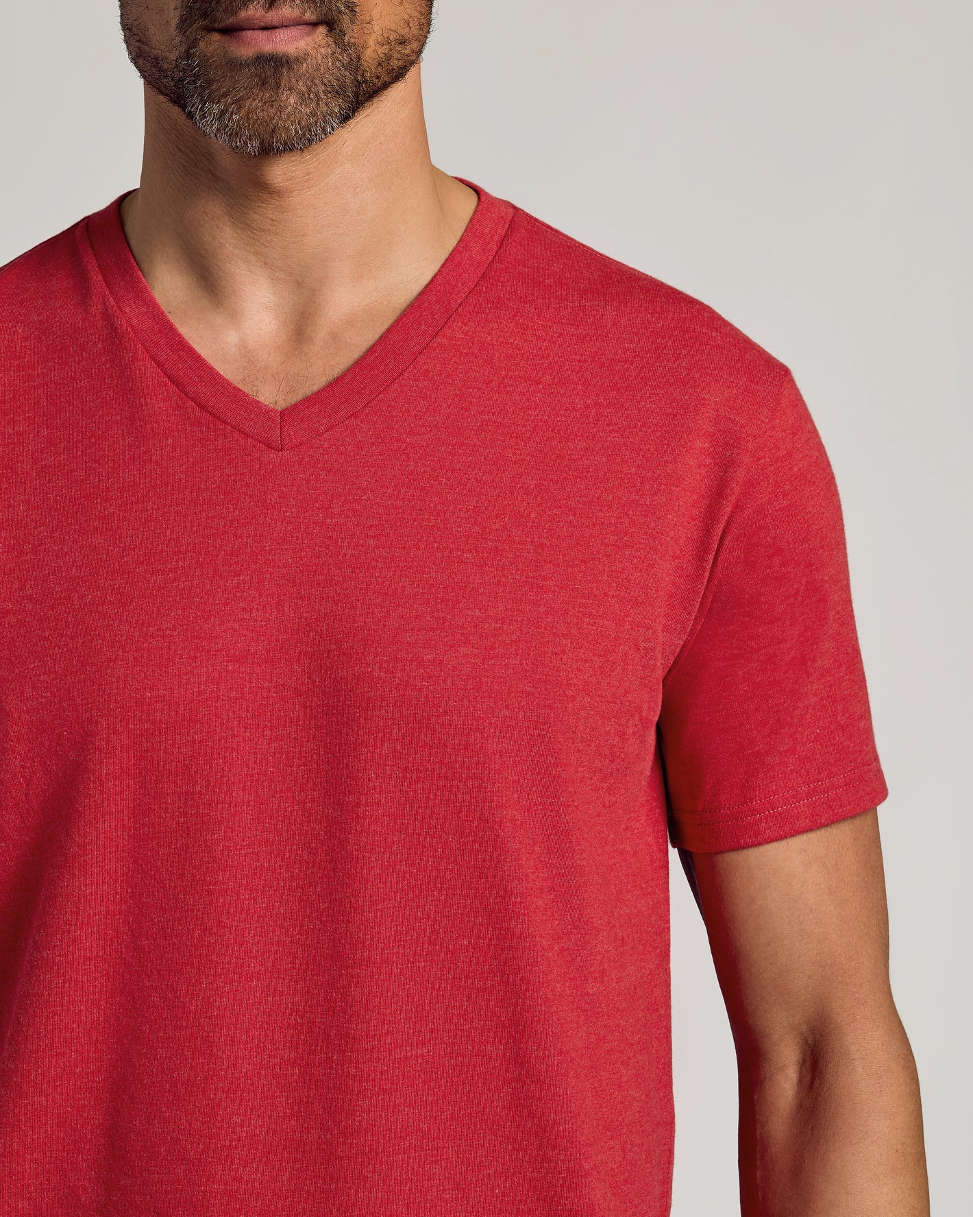 Man wearing Dark Heather Lava Classic V-Neck T-shirt, showcasing fit.