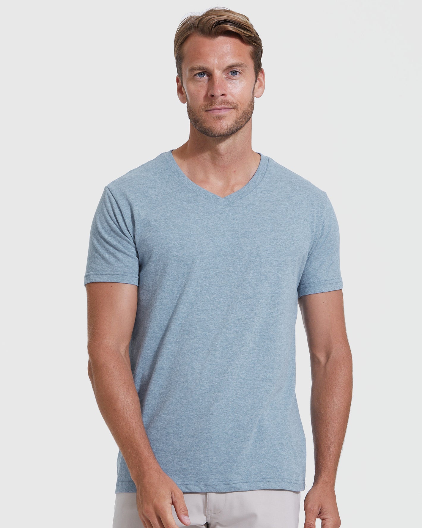 Man wearing Classic V-Neck 10-Pack shirt, relaxed pose.
