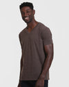 Man modeling Heather Dark Oak Classic V-Neck T-shirt with dark pants.