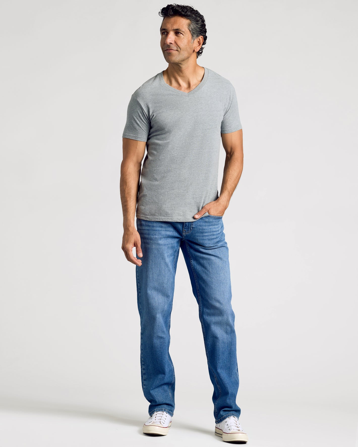 Man wearing Essential V-Neck Tee from 3-Pack set, heather gray.