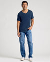 Man wearing Essential V-Neck Tee from 3-Pack, jeans, sneakers.