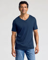 Man wearing Essential V-Neck Tee from 3-Pack, dark blue, medium-wash jeans.