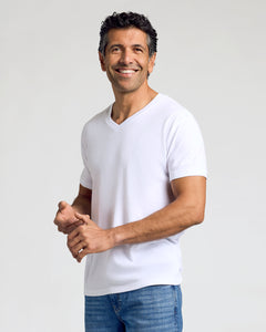 True ClassicMan wearing All White Classic V-Neck 10-Pack, smiling in casual attire.