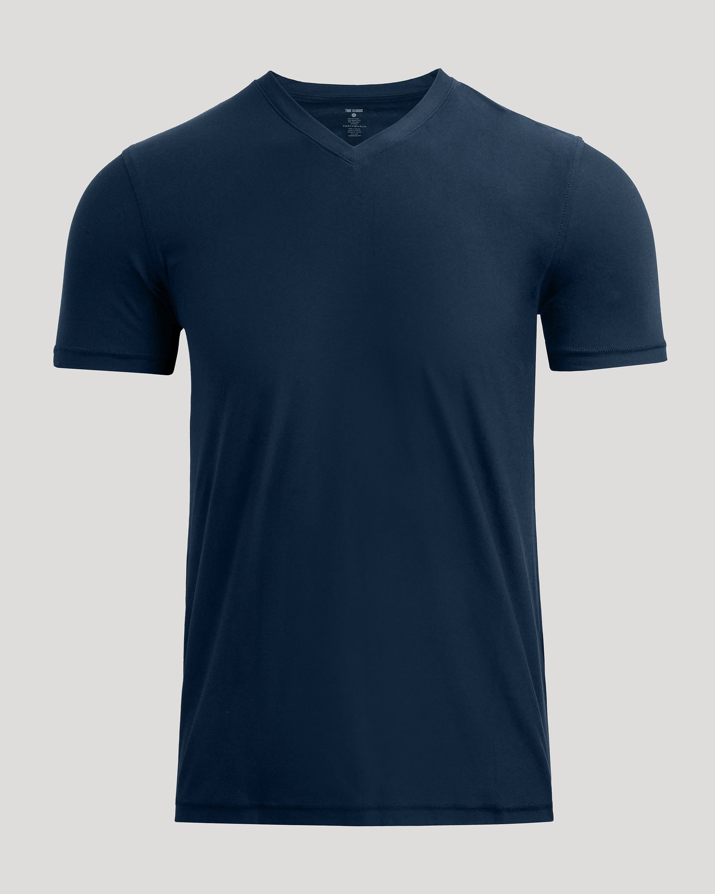 Navy Active V-Neck T-shirt on gray backdrop. Short-sleeved, modern fit.