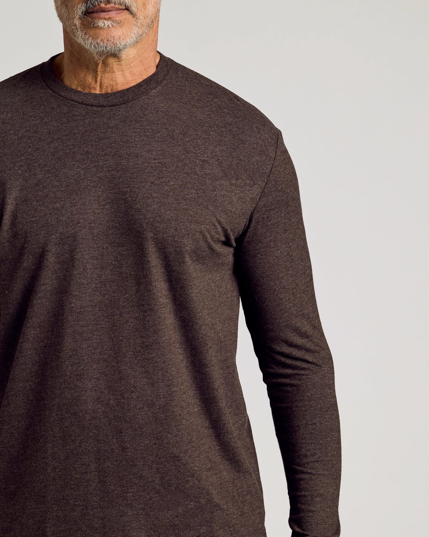 Dark Heather Cocoa Classic Long Sleeve Crew Neck worn by bearded man.