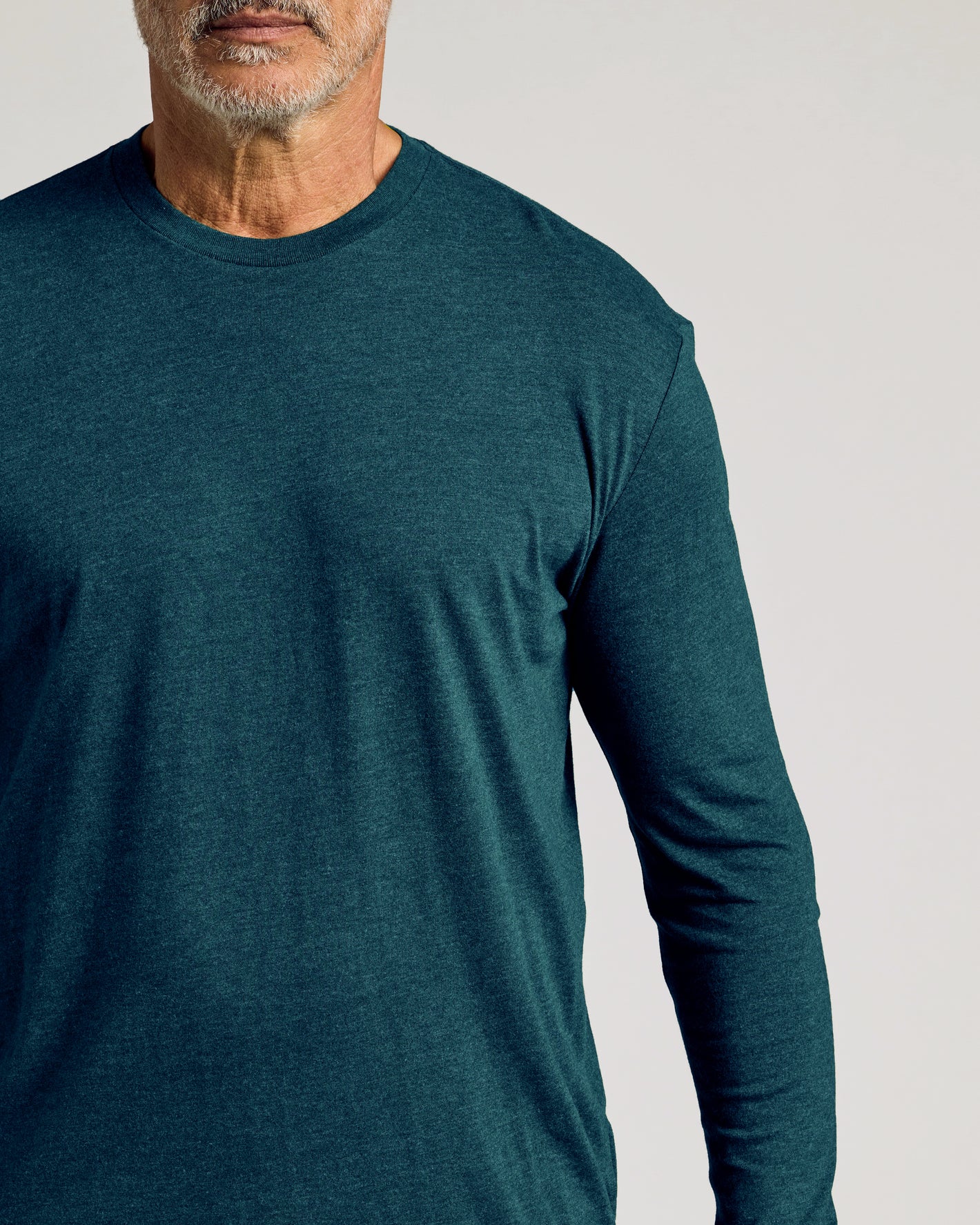 Man wearing Dark Heather Pond Long Sleeve Crew Neck Tee.