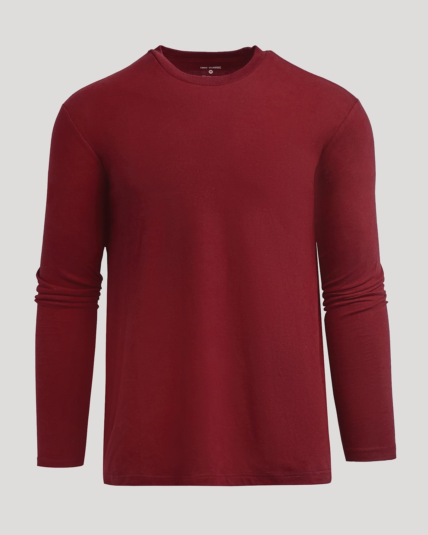 Dark Maroon Classic Long Sleeve Crew Neck against neutral backdrop.