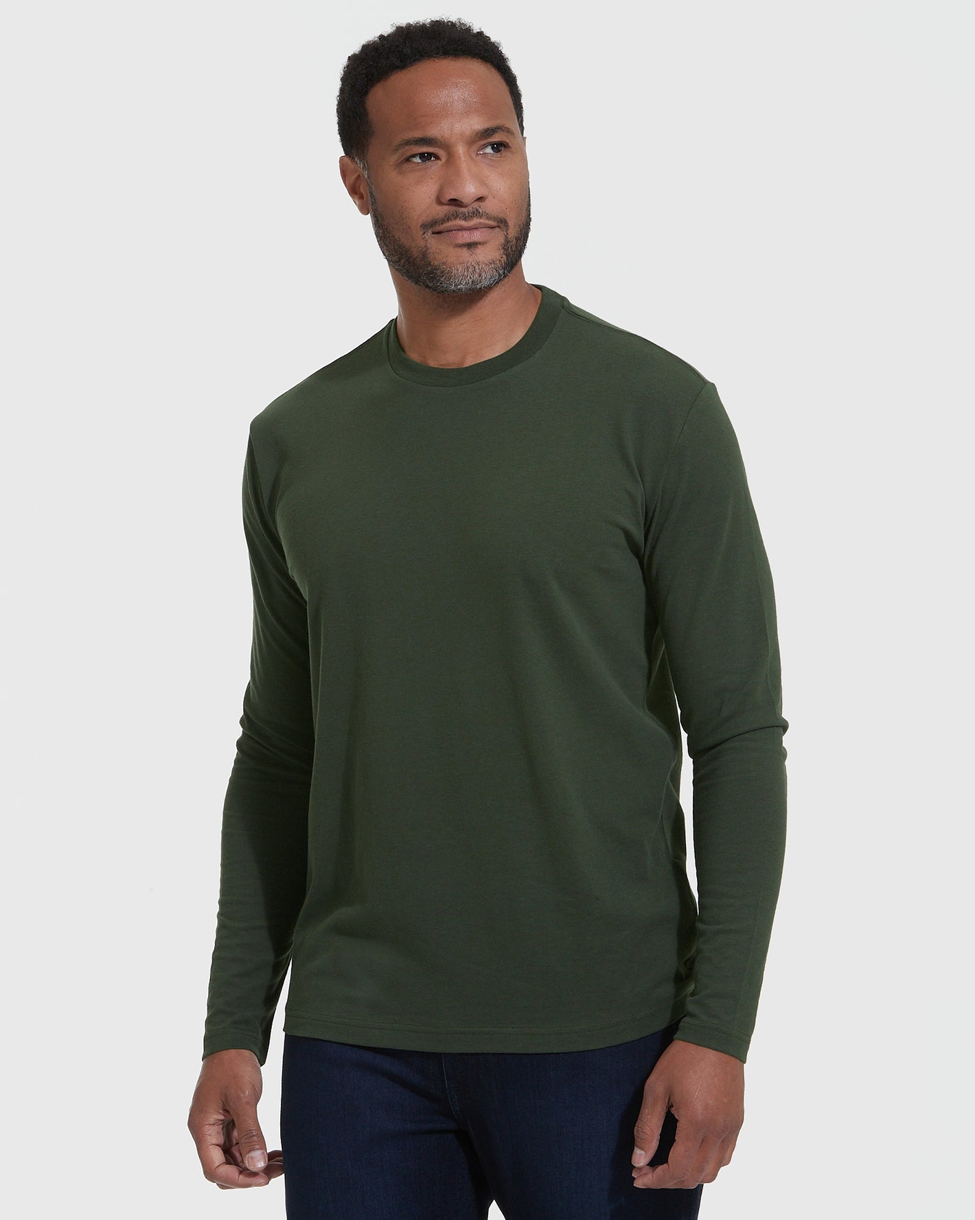 Dark Olive Classic Long Sleeve Crew Neck modeled with jeans.