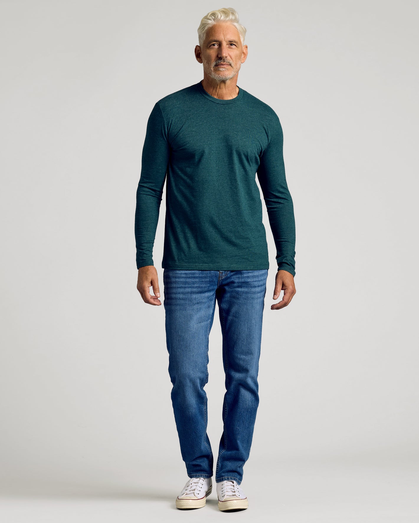 Man wearing Dark Heather Seafarer Classic Long Sleeve Crew Neck.