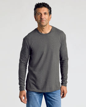 Man wearing Charcoal Heather Gray Classic Long Sleeve Crew Neck and blue jeans.