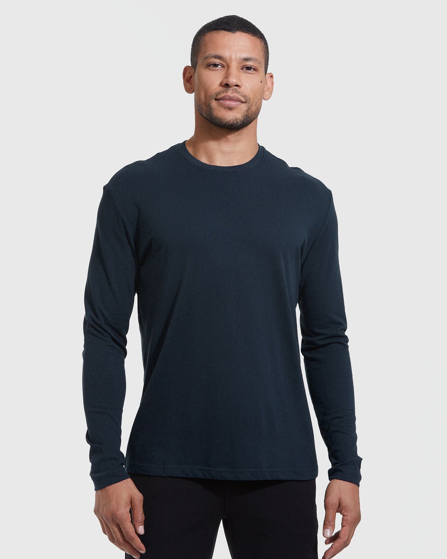 Model wearing Crew Core Sleeve Variety 6-Pack long-sleeve shirt.